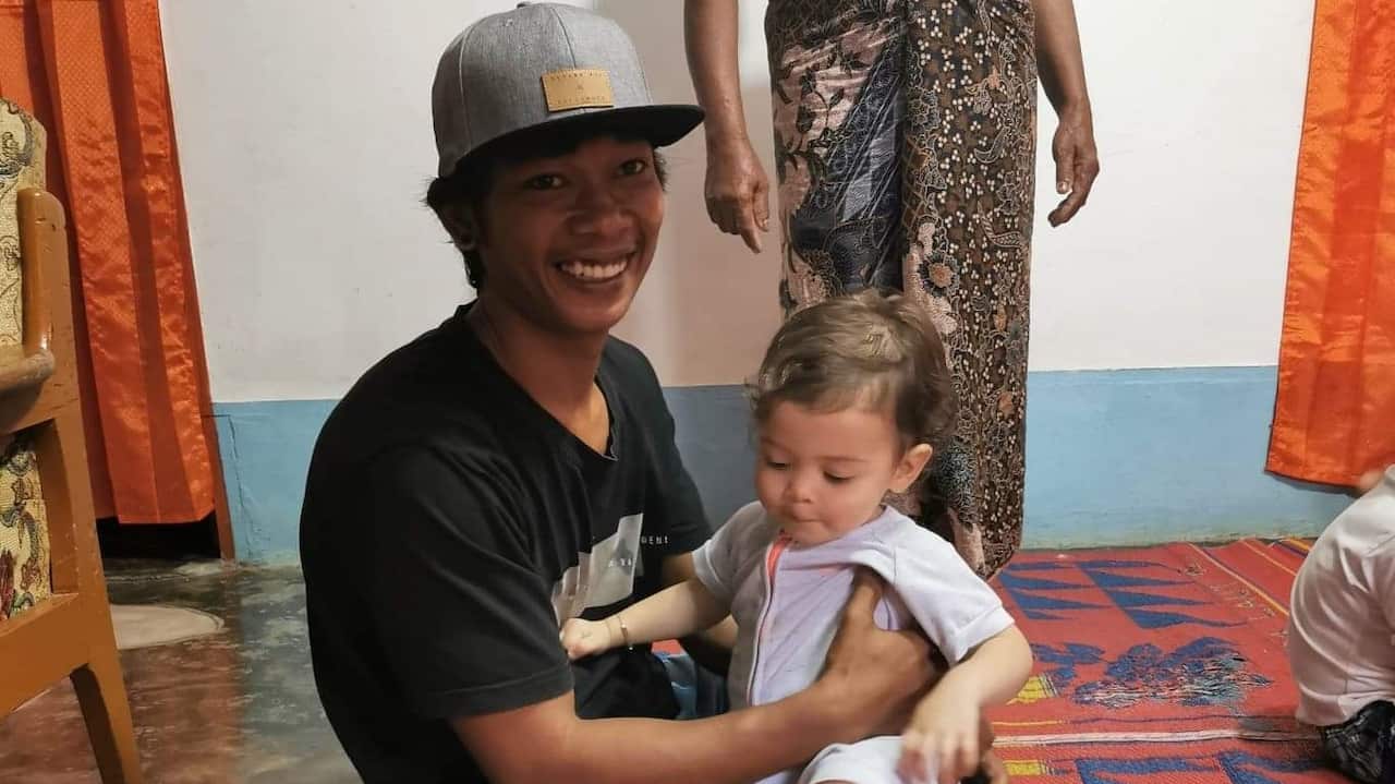 Endo with his niece in Indonesia. 