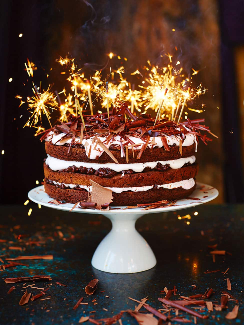 Chocolate celebration cake with sparklers. 