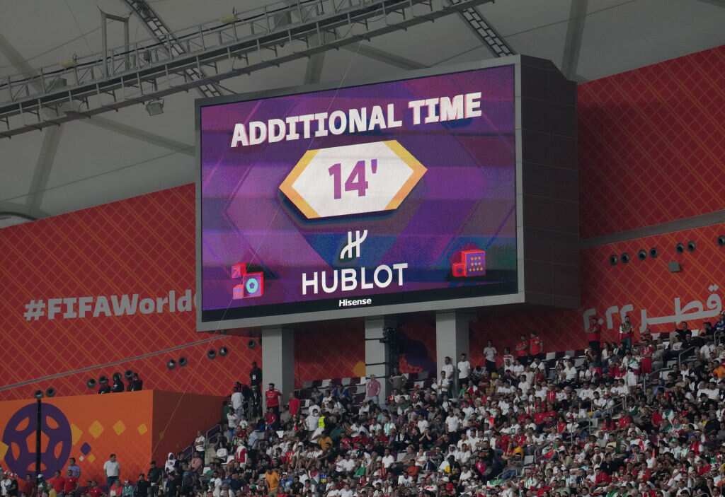 A scoreboard in a stadium. It reads: Additional Time 14'