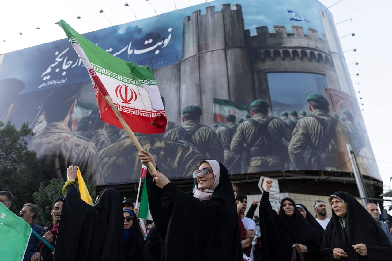 People waving Iranian flags.