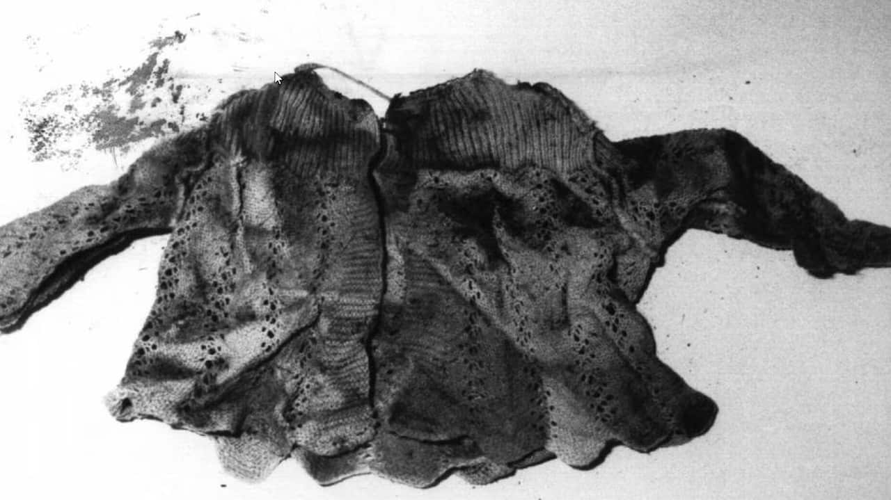 a black and white photo of a bloody baby jacket