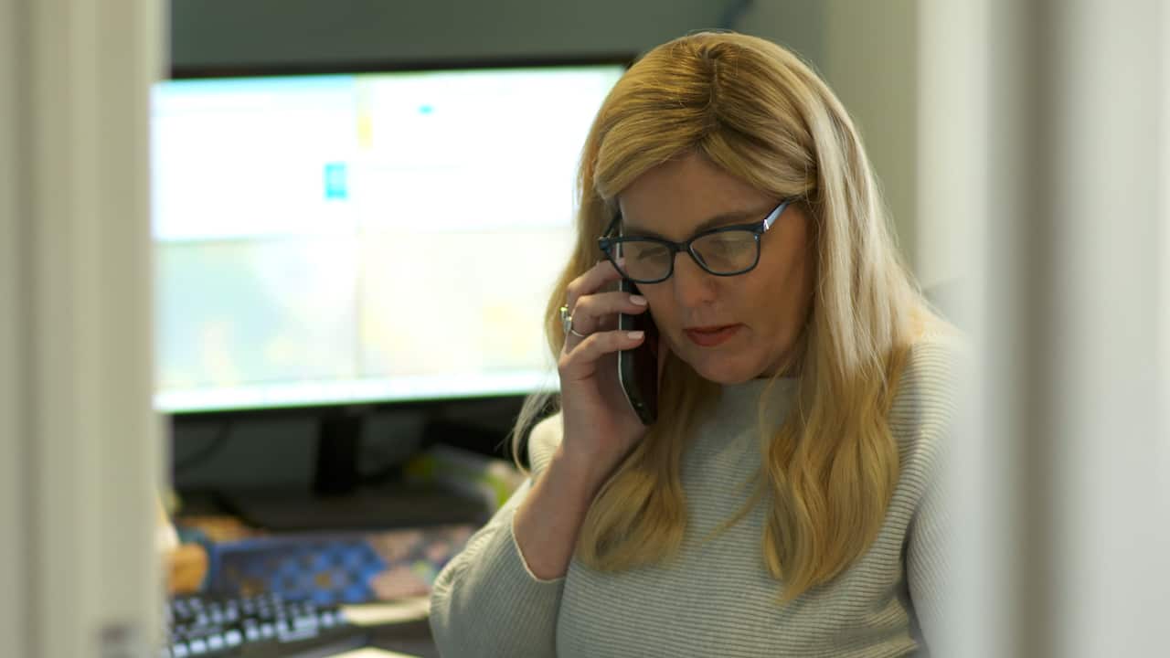 A blonde woman on the phone