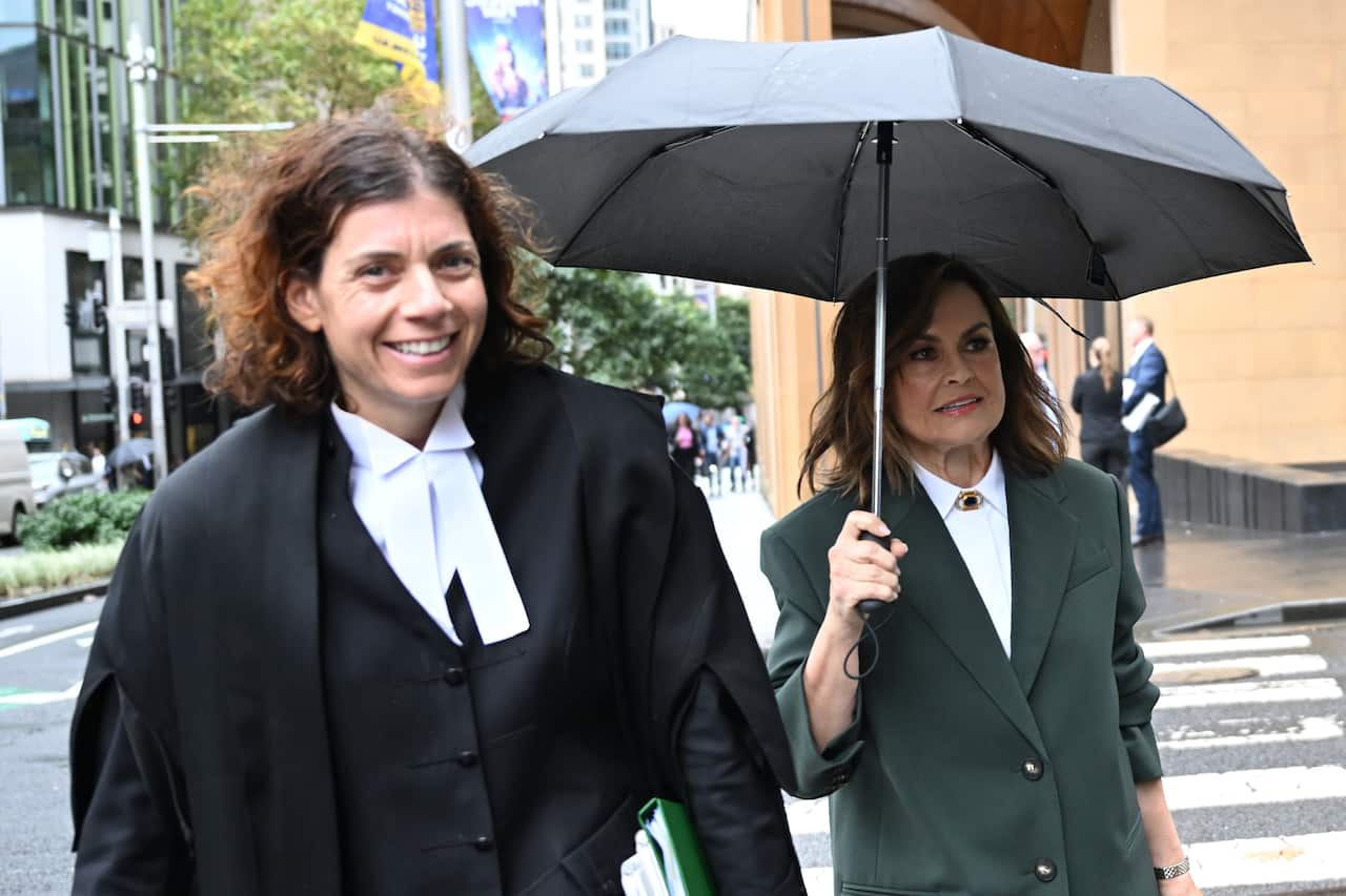 Two women walking outside.