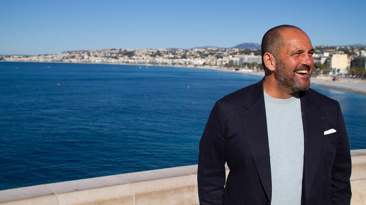 Guillaume Brahimi smiles in front of the blue waters of the Atlantic