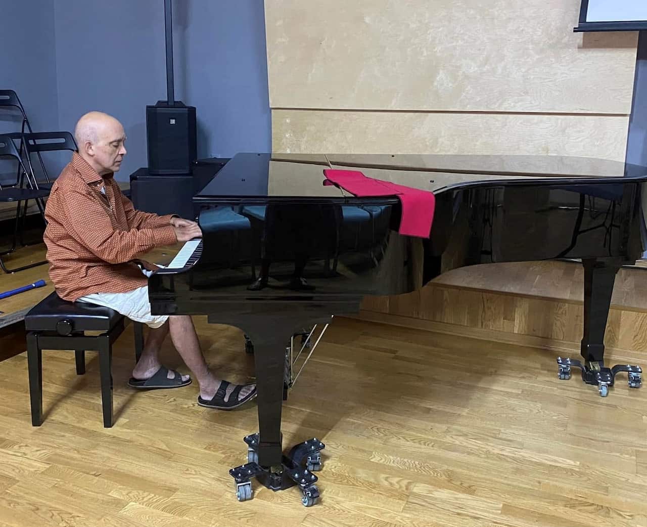 Achilles Yiangoulli, photographed here playing the piano at the Tsitsanis Museum, in the Greek city of Trikala