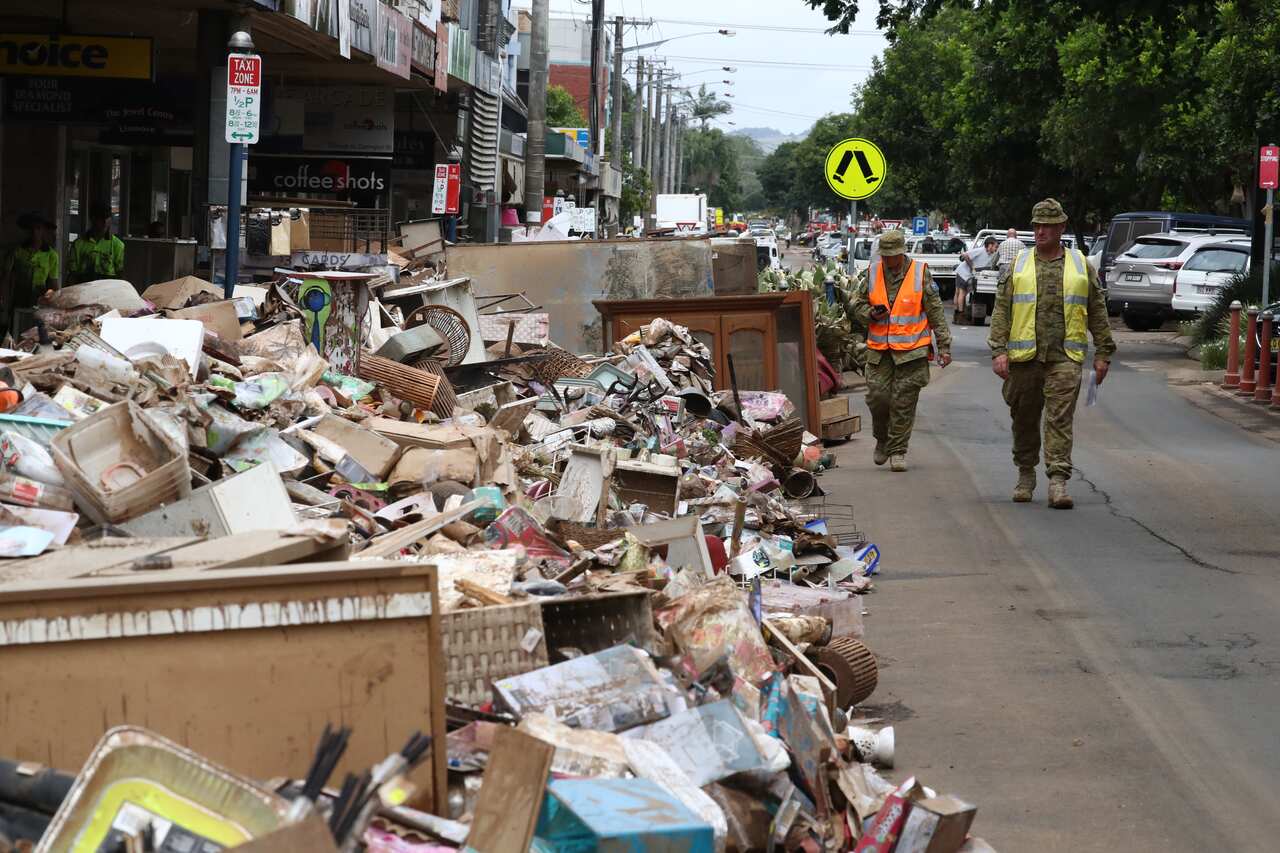 Australian Defence Force Personel assist with the clean up after the floods in the Central Business District of Lismore, NSW.
