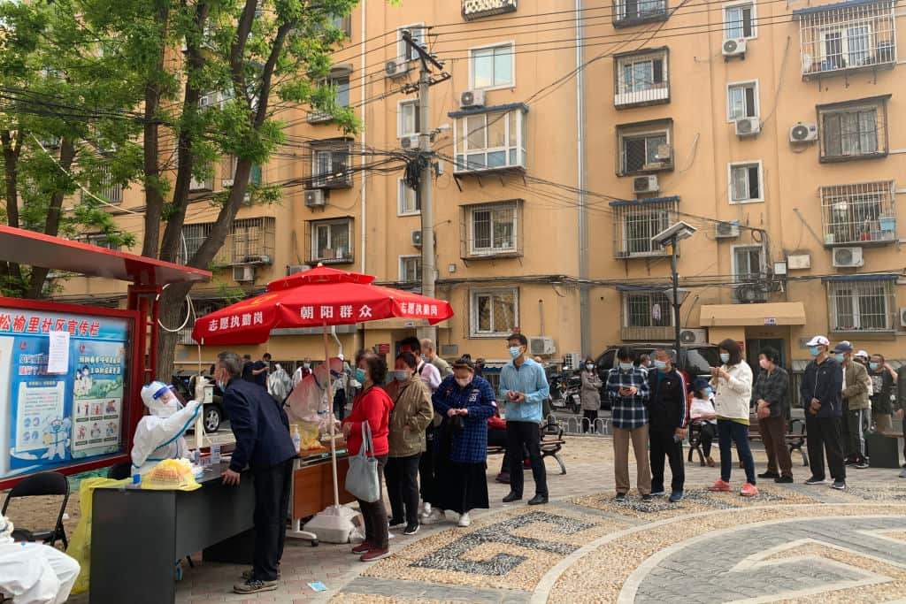 Residents queue up for COVID-19 nucleic acid tests at Songyuli community in Beijing, China. 