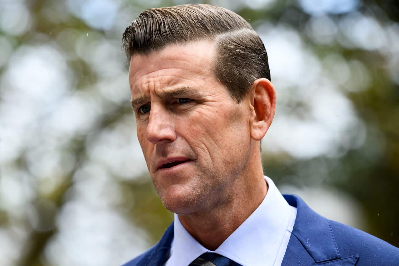A close up shot of Ben Roberts-Smith wearing a blue suit