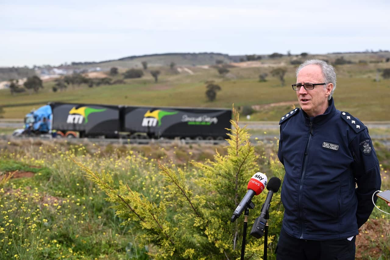 Victoria Police Detective Inspector Roger Schranz is pictured speaking media at the scene of a collision between a school bus and a truck in Bacchus Marsh, Greater Melbourne.