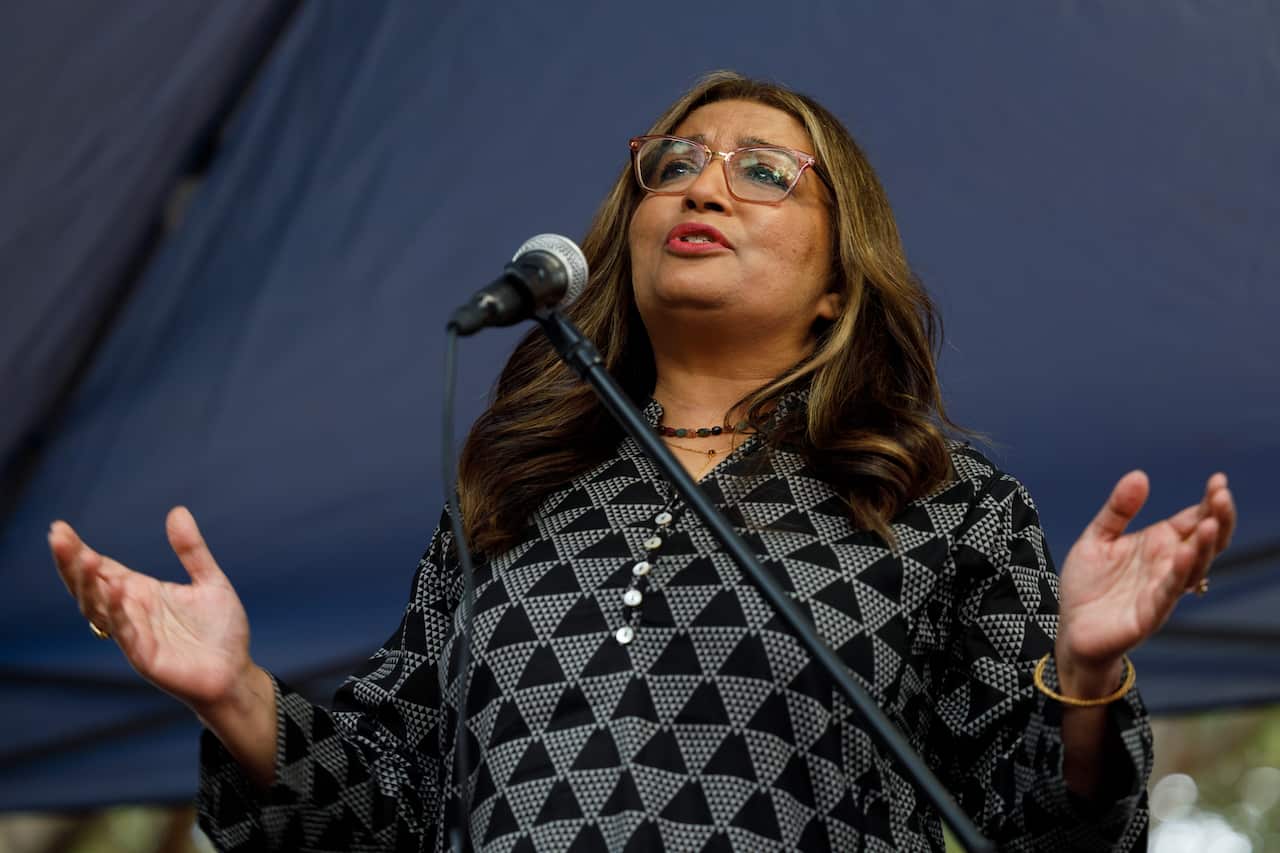 Senator Mehreen Faruqi standing and speaking into a microphone