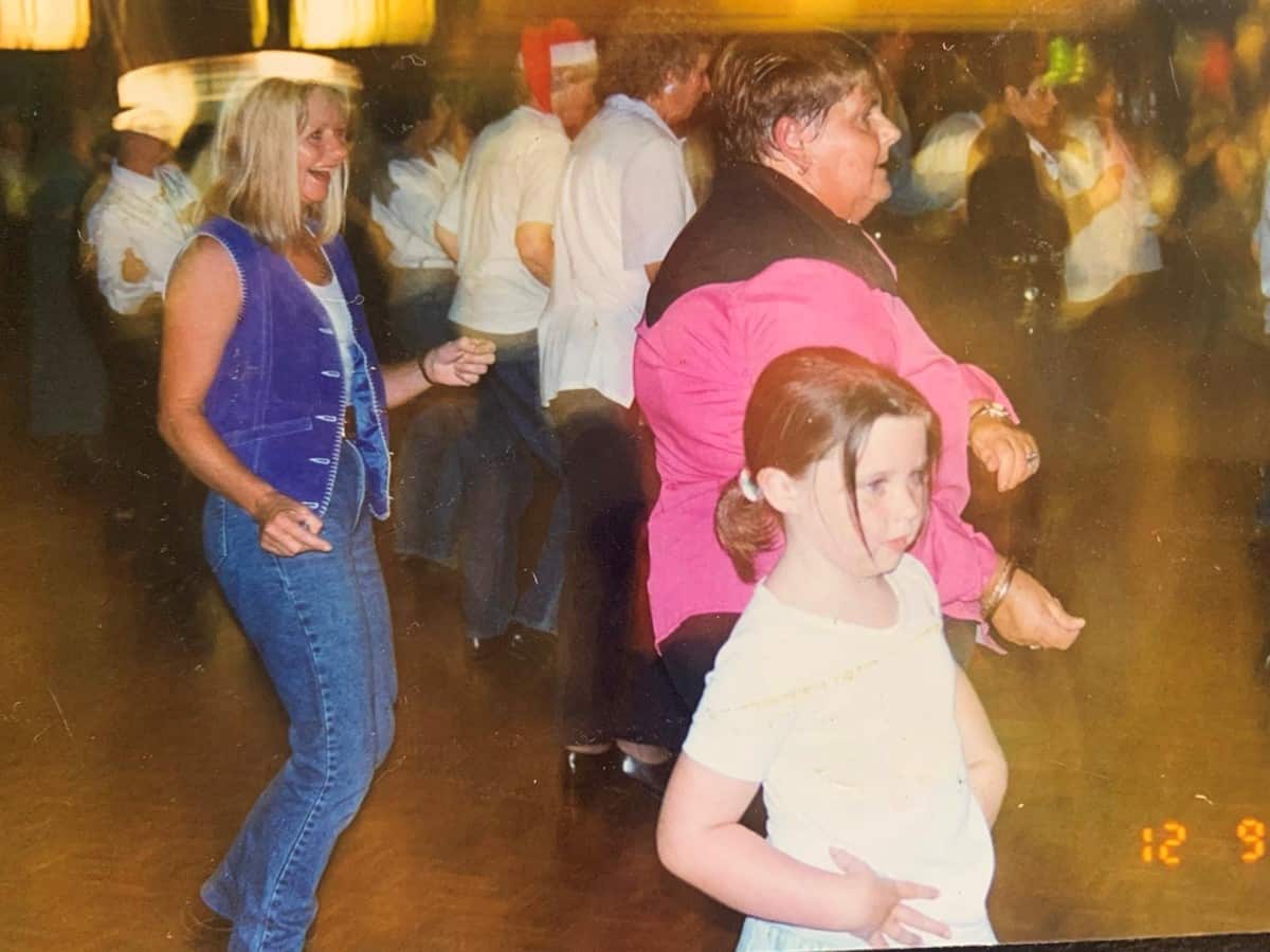 Three people linedancing