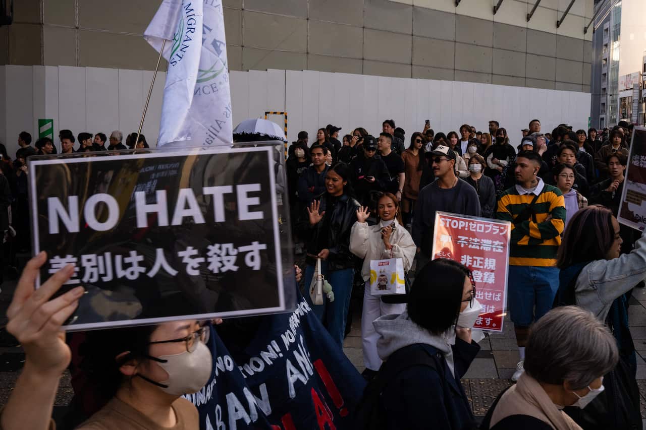 Demonstrators take part in a protest against anti-immigrant policies, in Tokyo.