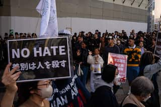 Demonstrators take part in a protest against anti-immigrant policies, in Tokyo.