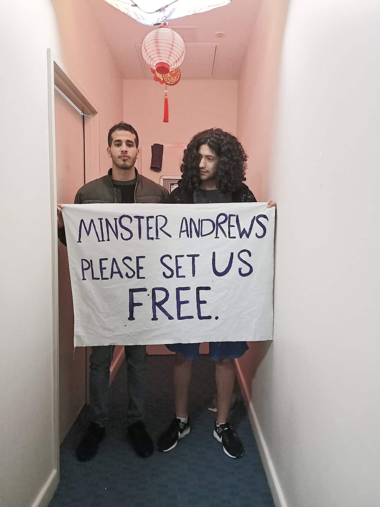 Mehdi pictured with his cousin in detention.