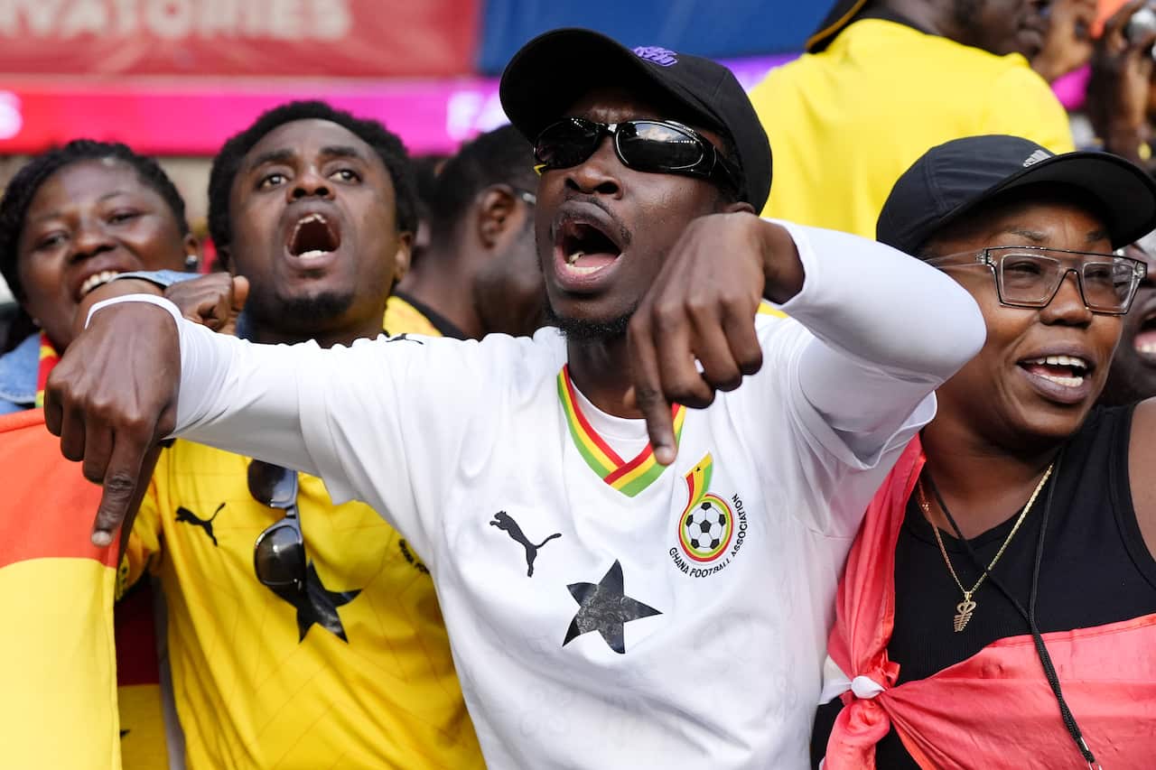 Four fans wearing Ghana black stars jerseys