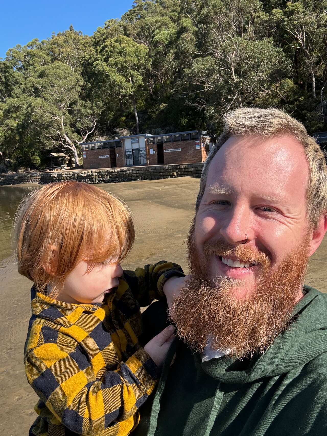 A man holds his young son.