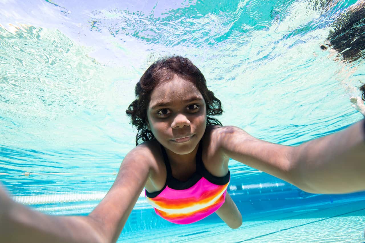 Underwater selfie of Indigenous Australian Aboriginal girl swimming