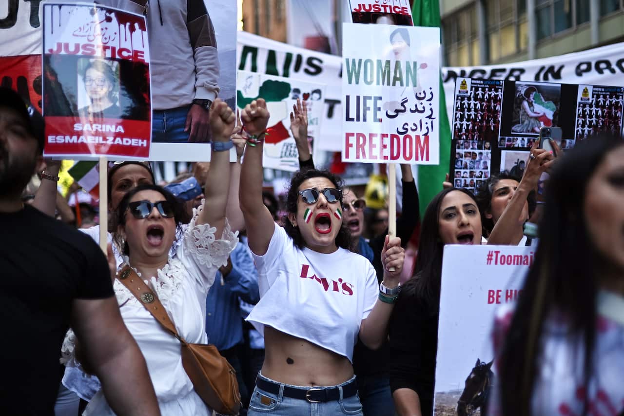 Protesters take part in a “Woman, Life, Freedom” rally for Iran women in Sydney.