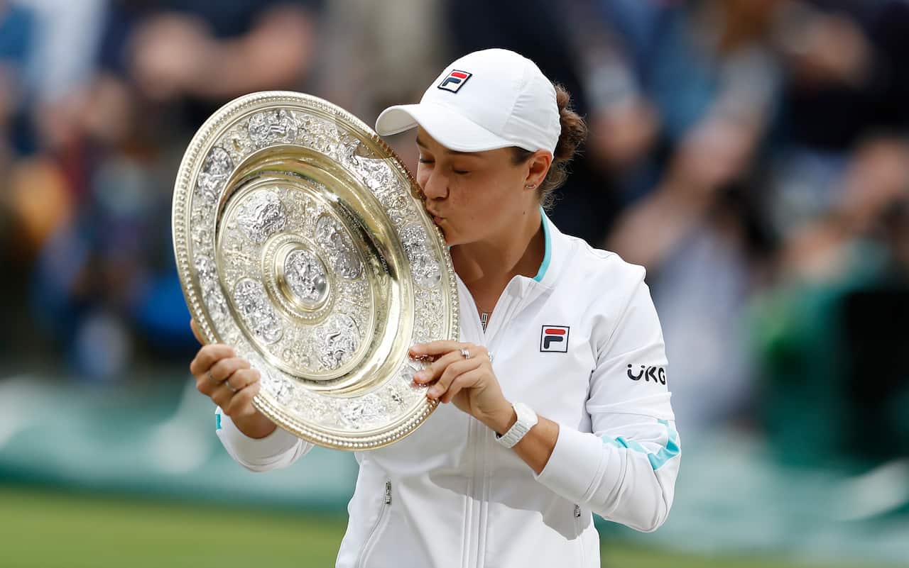 Ash Barty kisses the trophy after winning the women's singles title at Wimbledon in 2021.