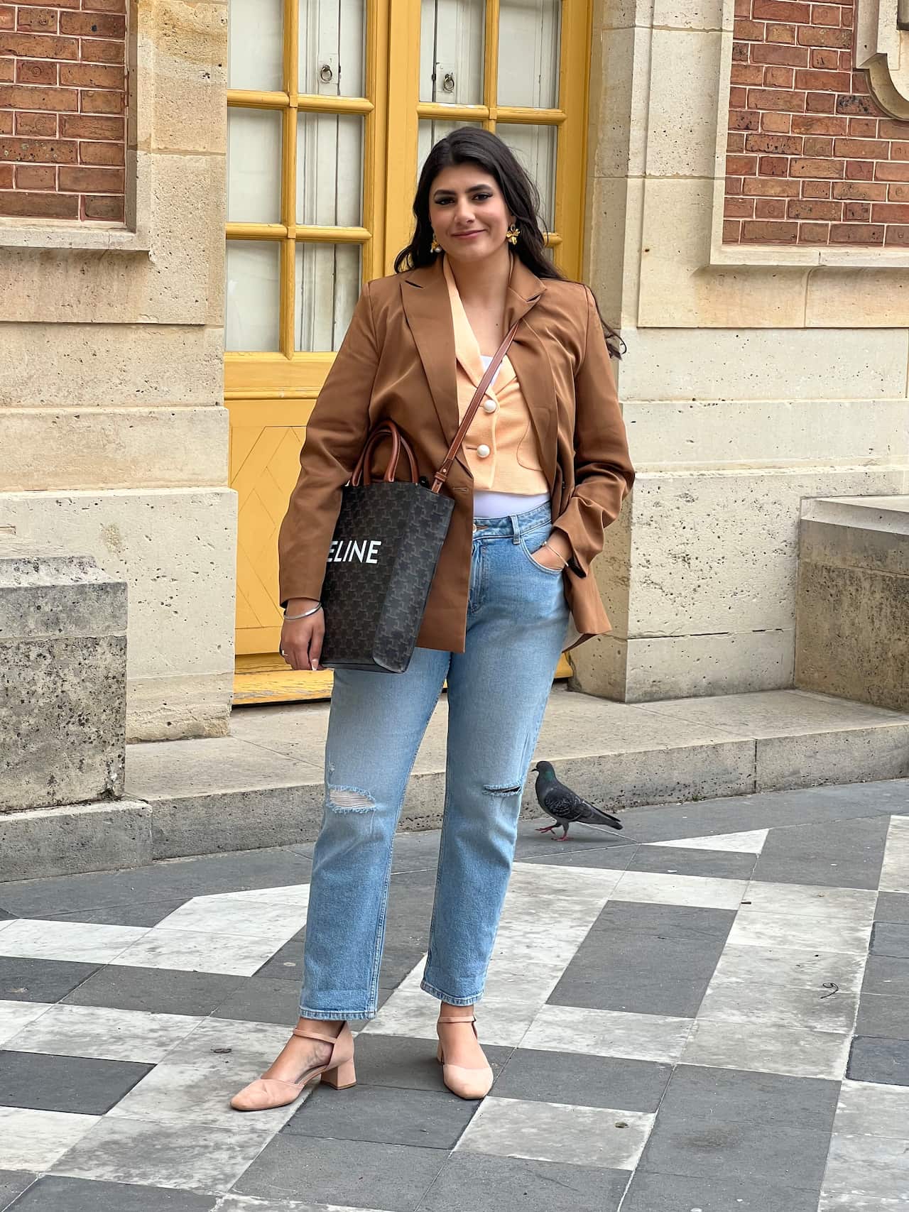 a woman standing in front of a building