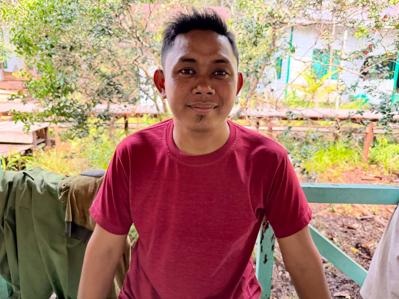 A man in a red t-shirt