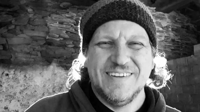 Greyscale picture of a man smiling