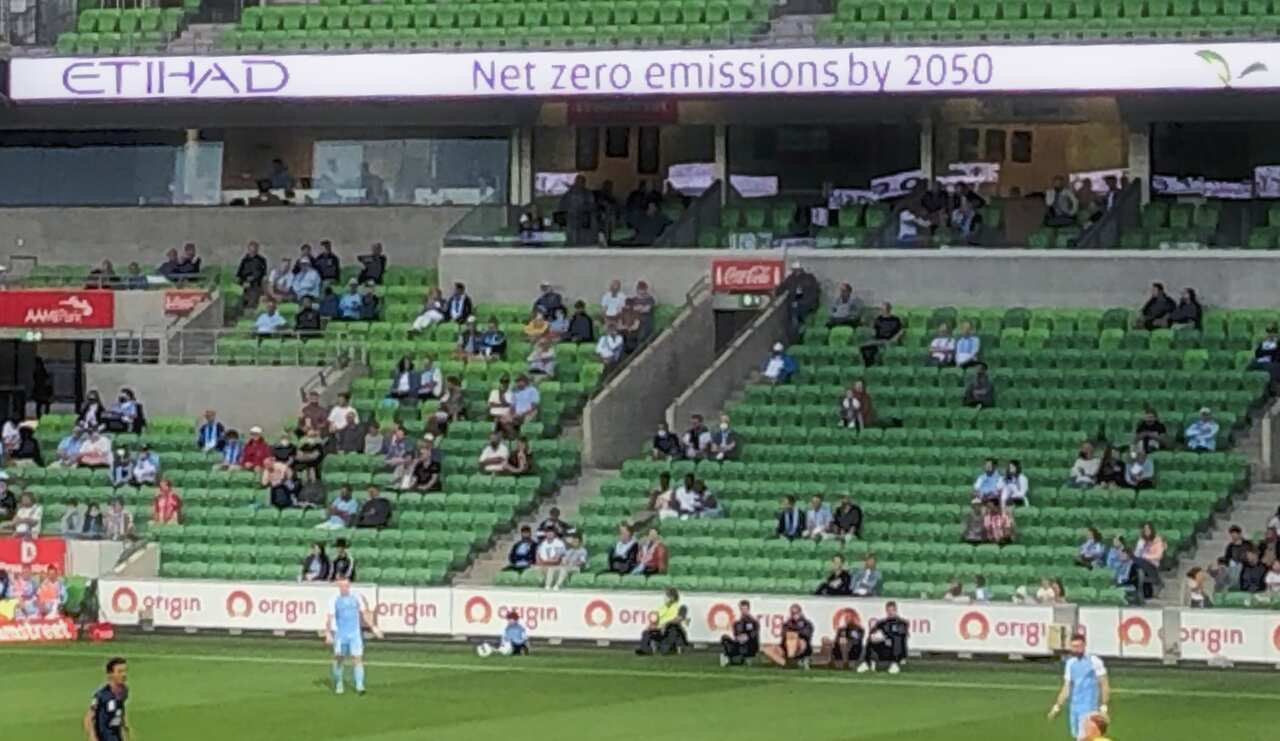 A football game, with banners on stands for Origin and Etihad. 