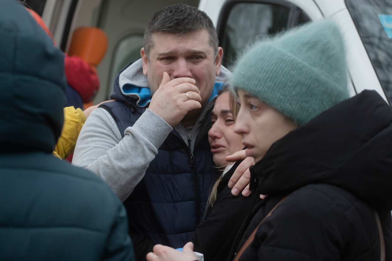 People crying and comforting each other