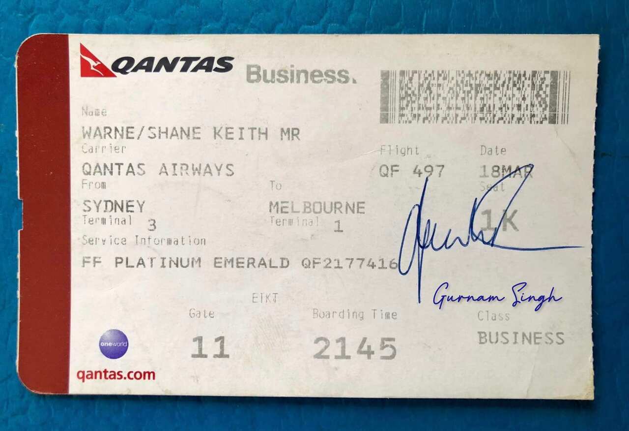 The boarding pass signed by Shane Warne for Gurnam Singh.