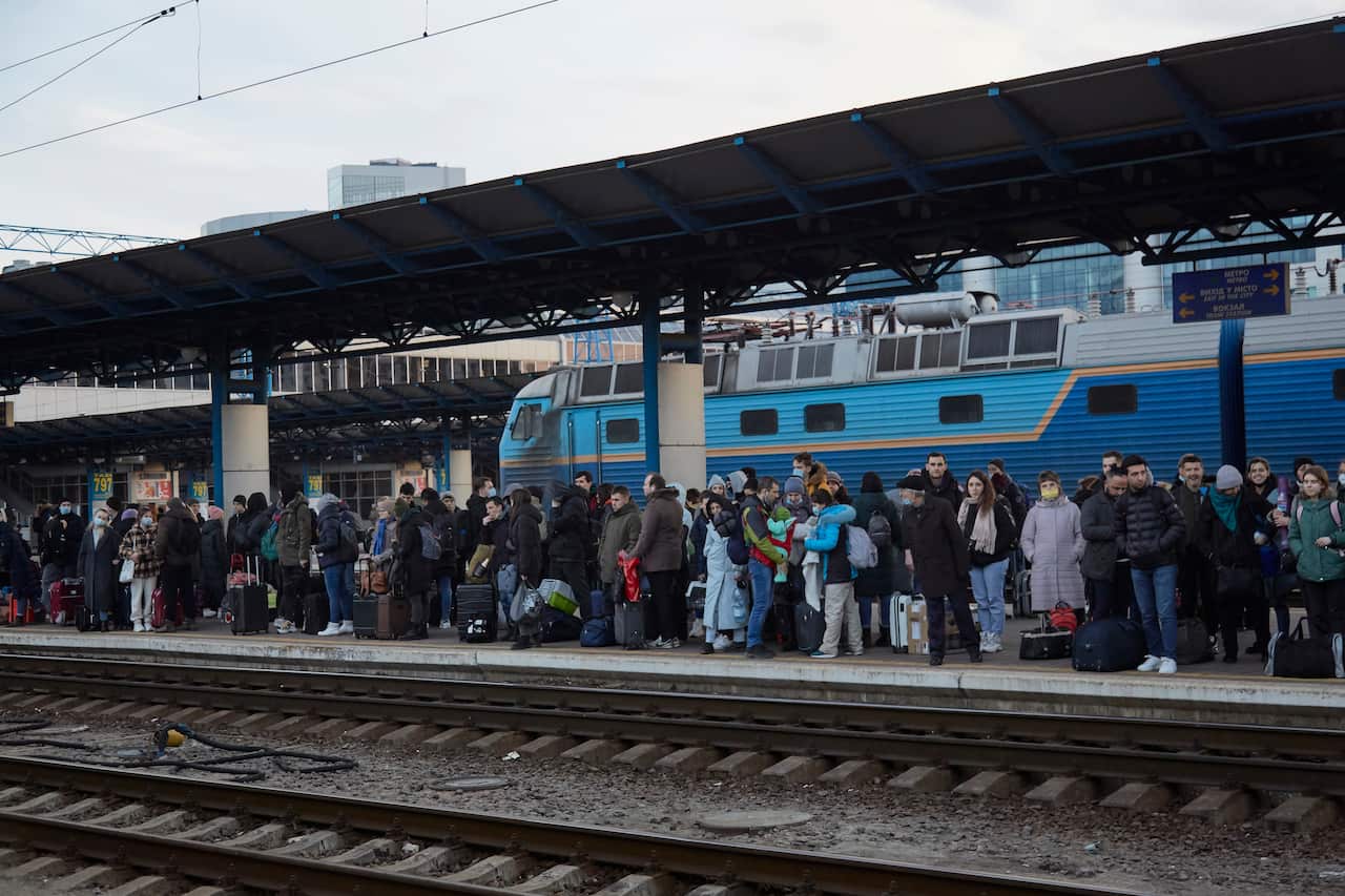 People wait for a delayed train to the west of Ukraine.