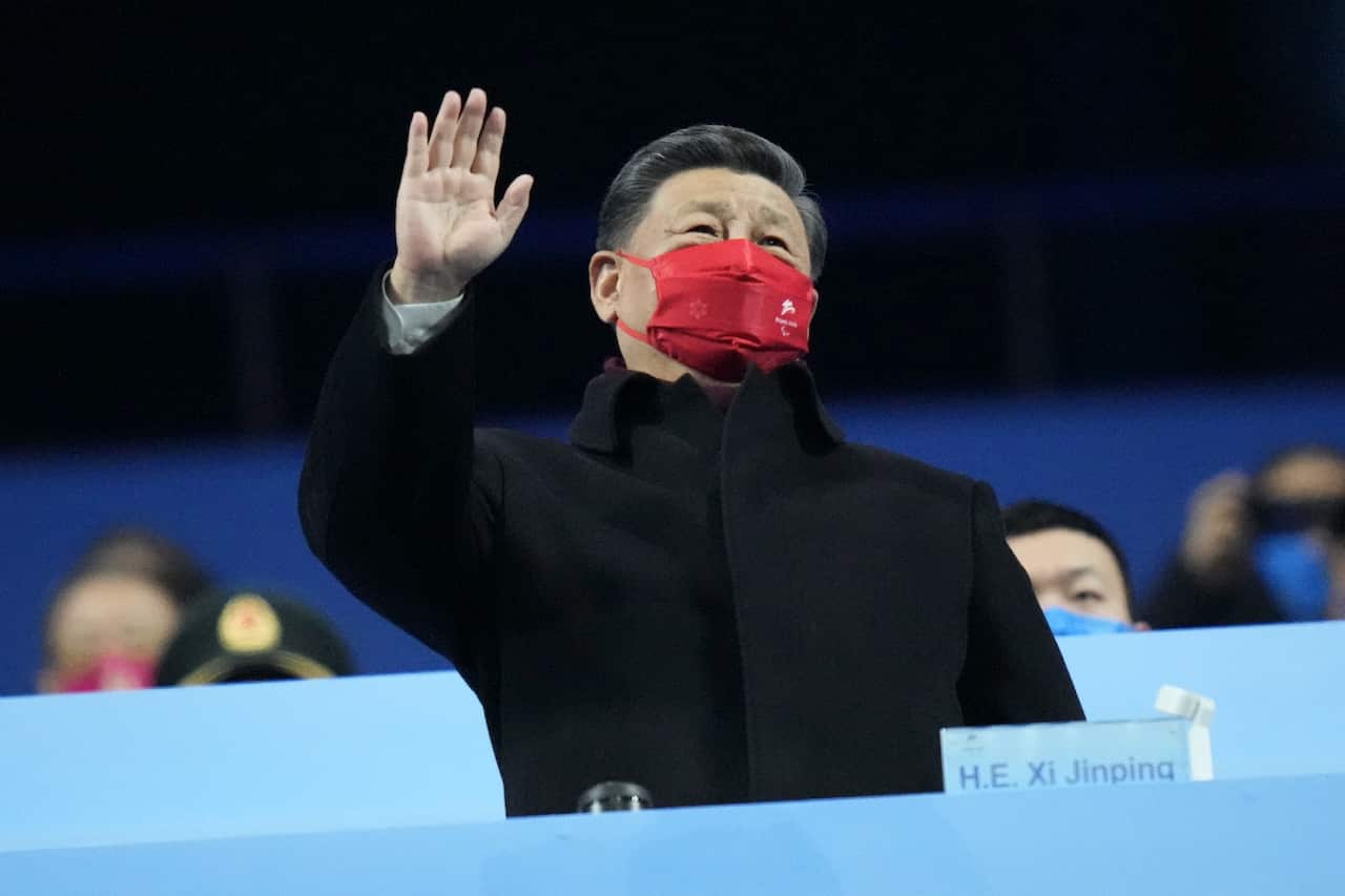 Xi Jinping waves during the closing ceremony at the 2022 Winter Paralympics on 13 March 2022.
