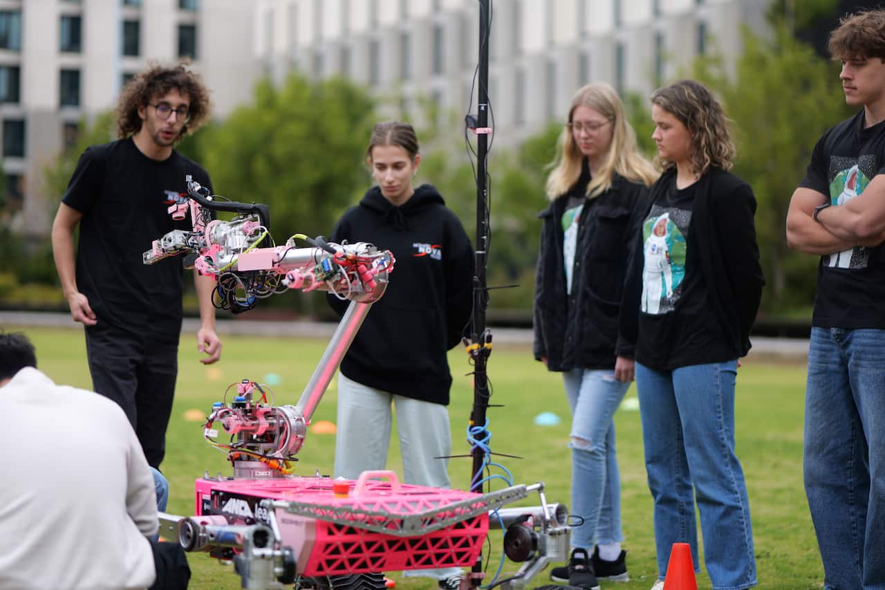 SPACE BOOTCAMP NISA 2025 cohort interacting with the Monash Nova Rover.JPG