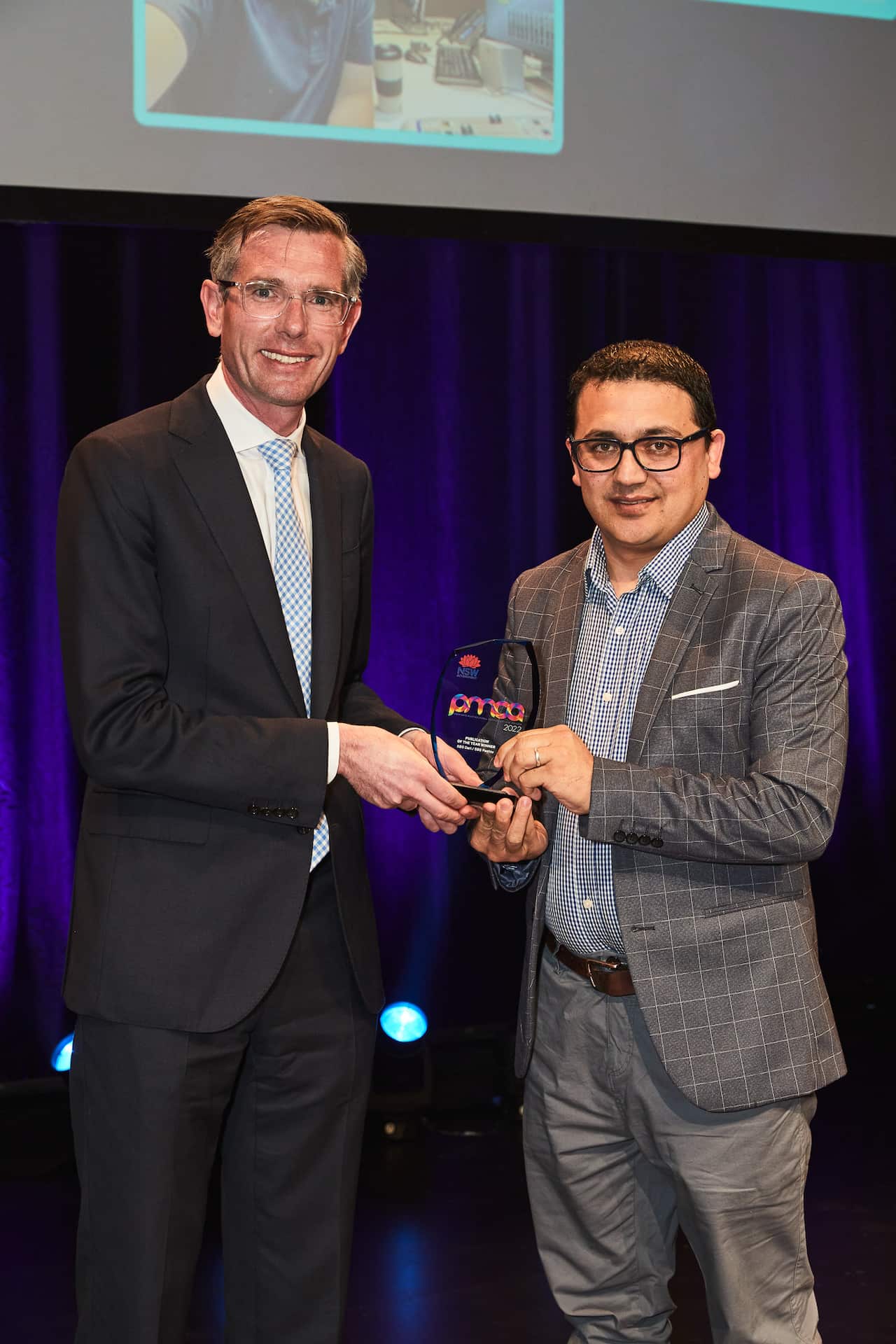 SBS Dari and Pashto producer Mujeeb Muneeb received the award from NSW Premier Dominic Perrottet on behalf of both language programs.

