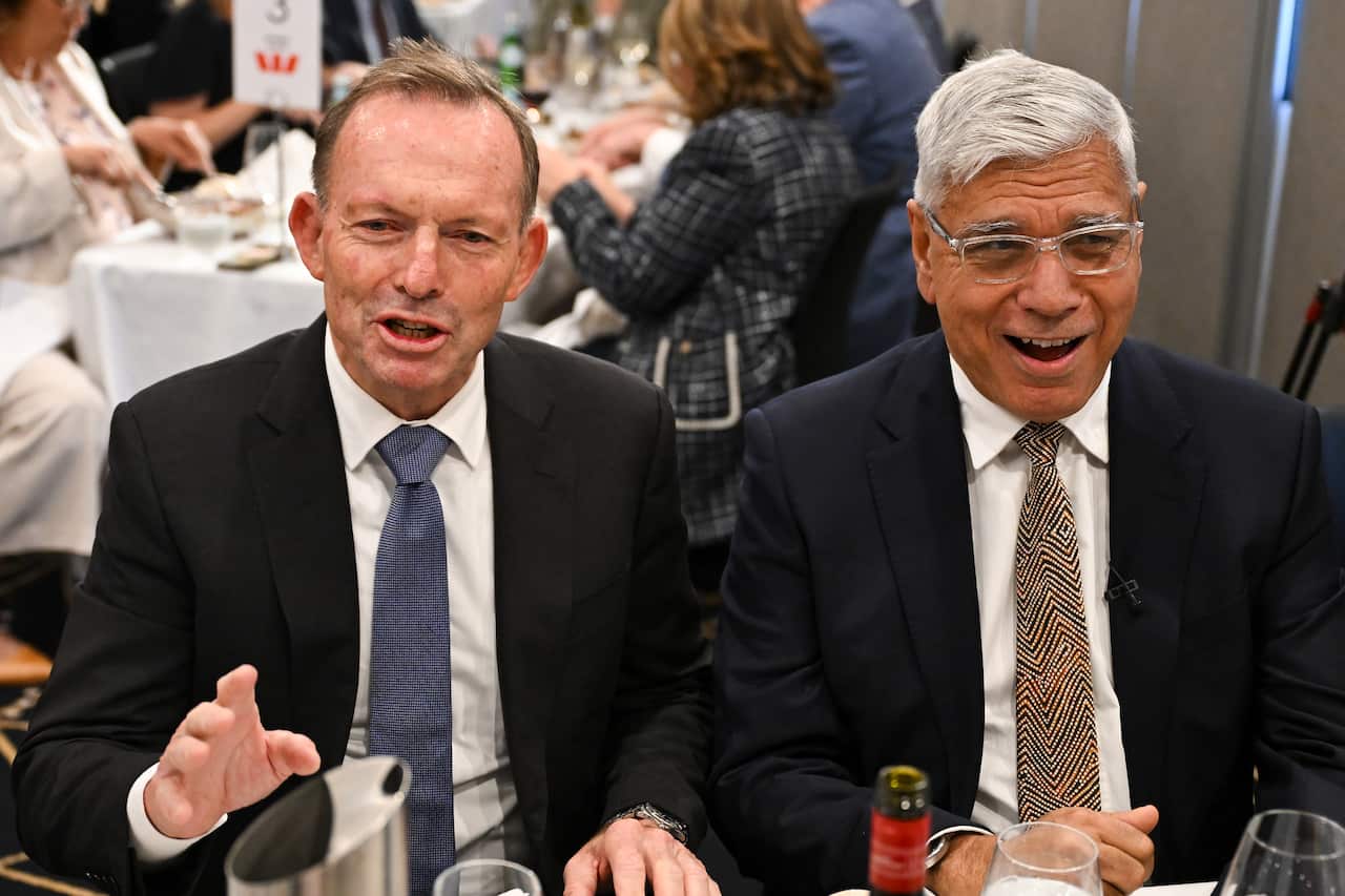 Tony Abbott and Warren Mundine sitting together.