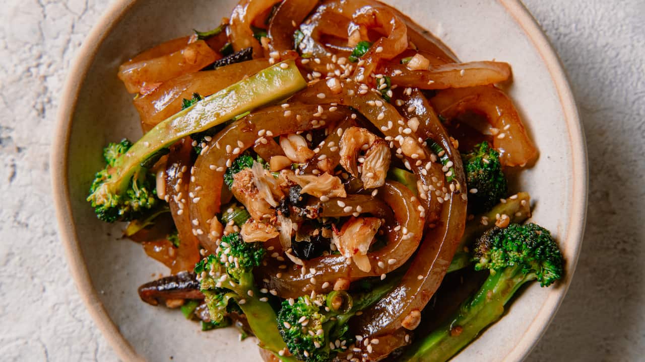 Stir-fried chewy potato noodles with broccoli