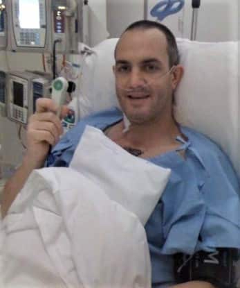 James Partington in a hospital bed 