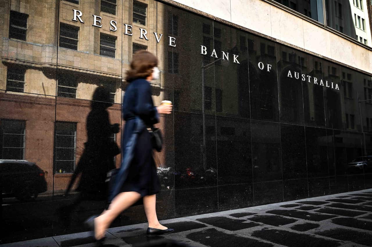 A pedestrian walks past the Reserve Bank of Australia (RBA) head office in Sydney.