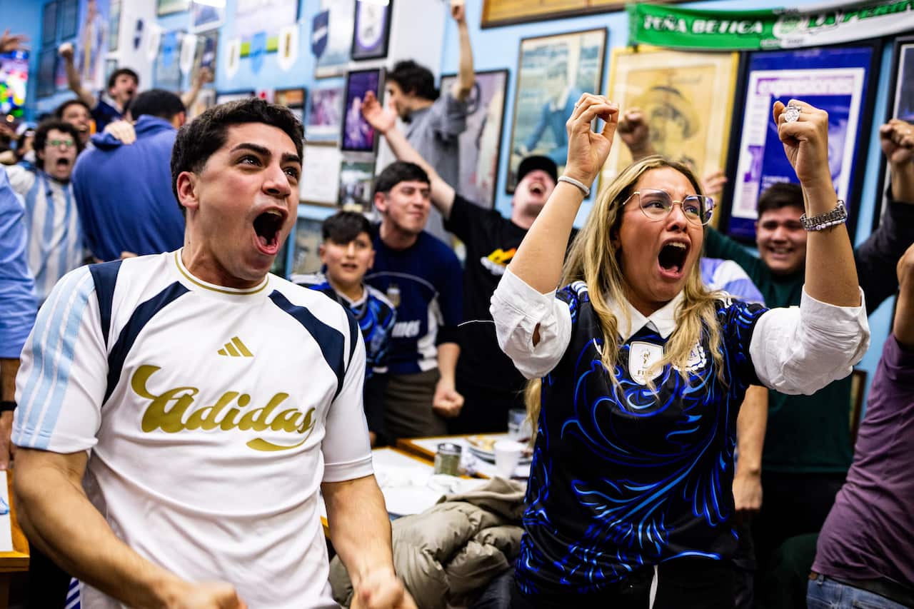 Argentinian fans celebrating in a restaurant