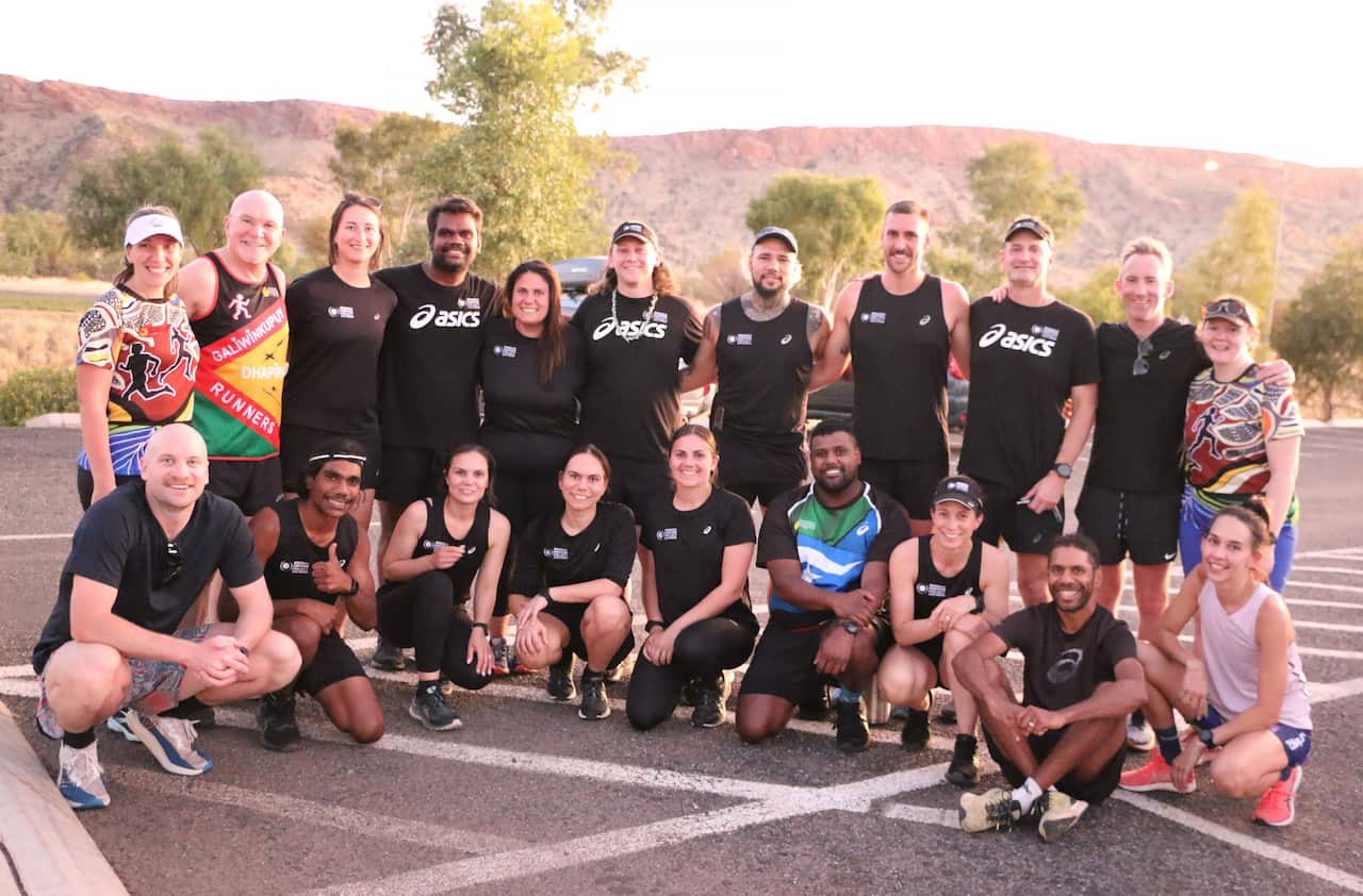 Charlie with 2022 IMP Squad and Mparntwe Social Run Club.JPG