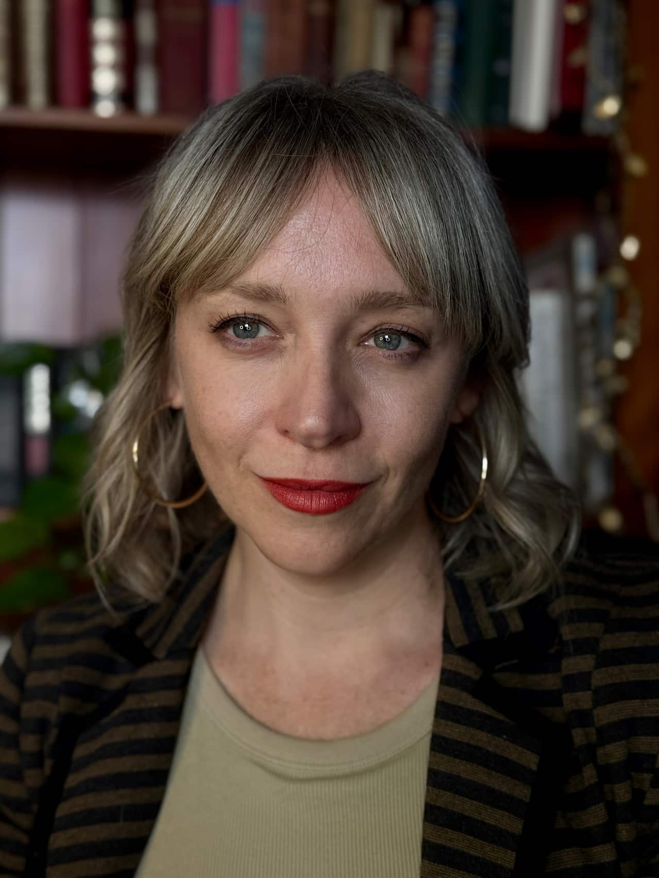 A headshot of a woman with shoulder-length hair.