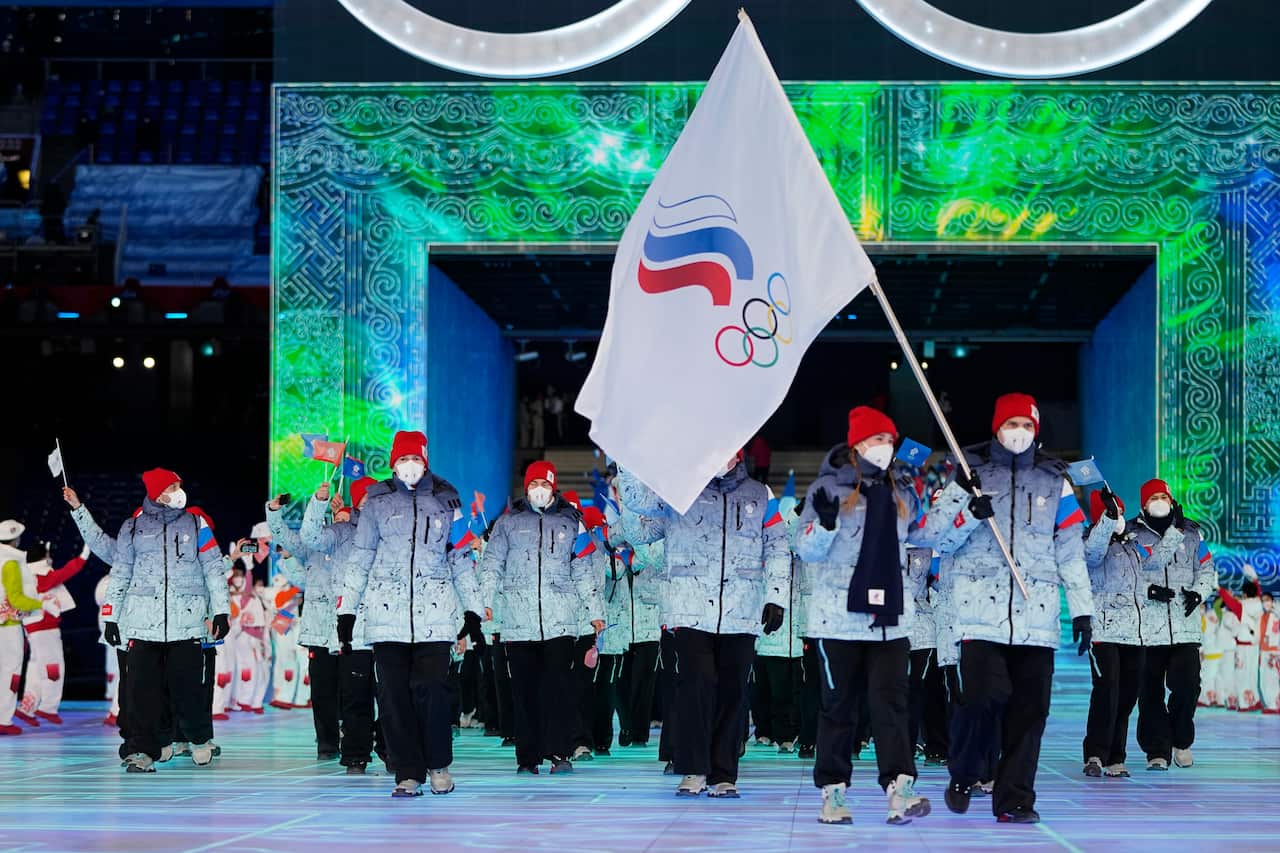 Russian athletes hold a flag at the opening ceremony for the 2022 Winter Olympic Games