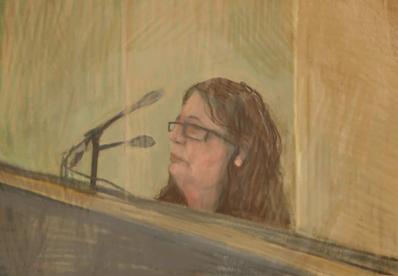 A sketch of a woman in court.