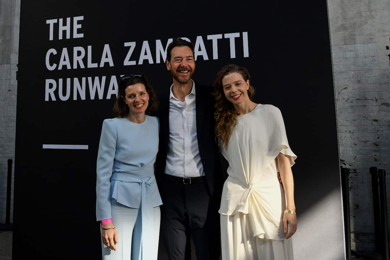 Allegra Spender, Alex Schuman and Bianca Spender pose for a photograph during a tribute to their mother and fashion designer Carla Zampatti at Australian Fashion Week 2021 in Sydney.