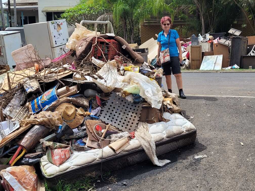 Susan Conroy on her street in Lismore in March 2022 between the two flood events. 