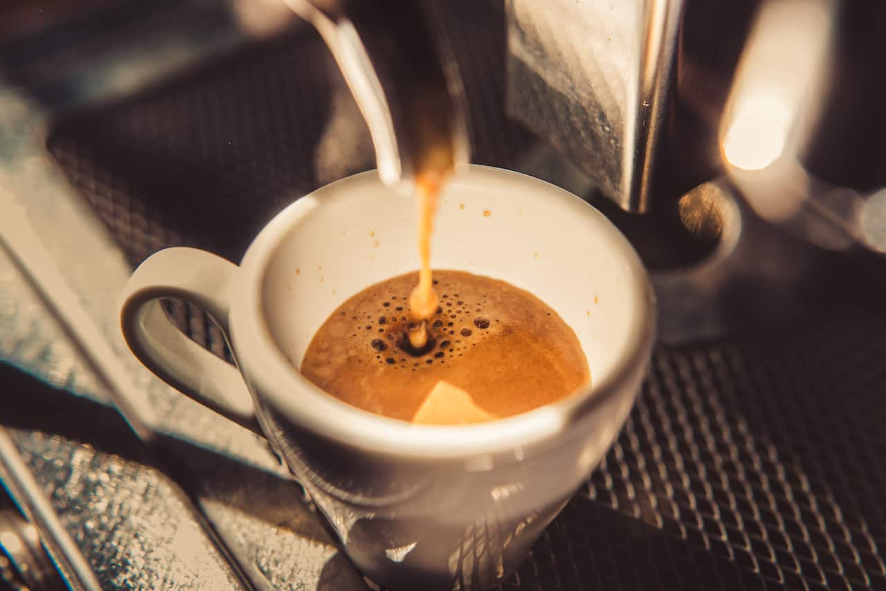 Espresso shot pouring out.