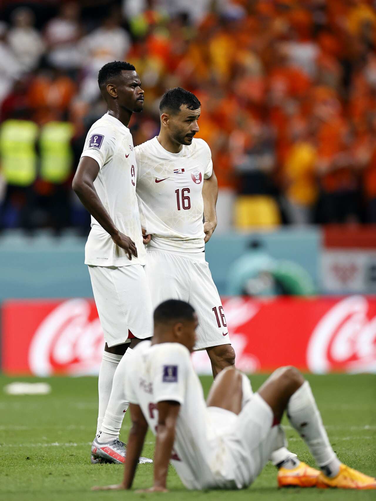 (LR) Mohammed Muntari of Qatar, Abdelkarim Hasan Fadlalla of Qatar, Boualem Khoukhi of Qatar disappointed during the FIFA World Cup Qatar 2022 group A match between Netherlands and Qatar at Al Bayt Stadium on November 29, 2022 in Al Khor, Qatar.