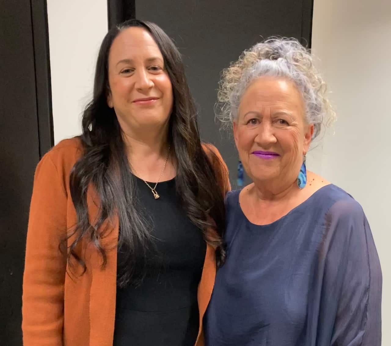 Sharon standing next to her daughter Ari.