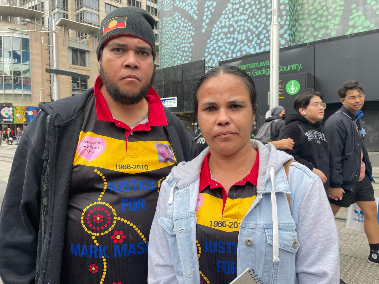 Two people facing camera standing