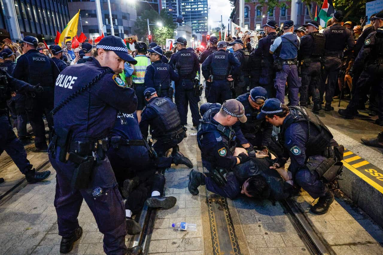 Police arresting protesters near Sydney's Town Hall. 