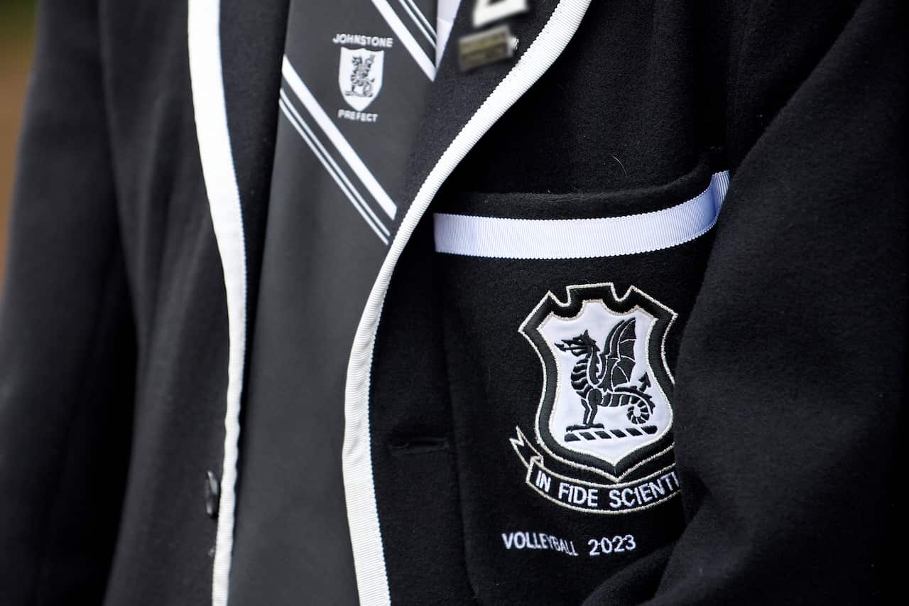 A close up of a school blazer.